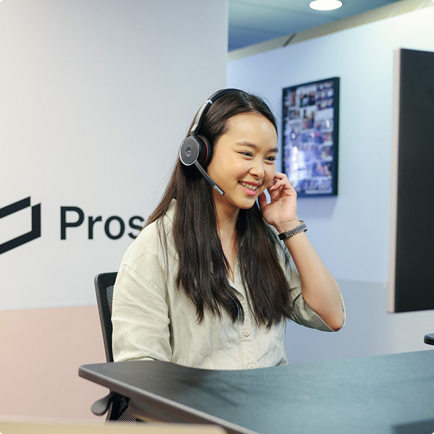 Customer Support Co-worker helping a Prospa customer over the phone.